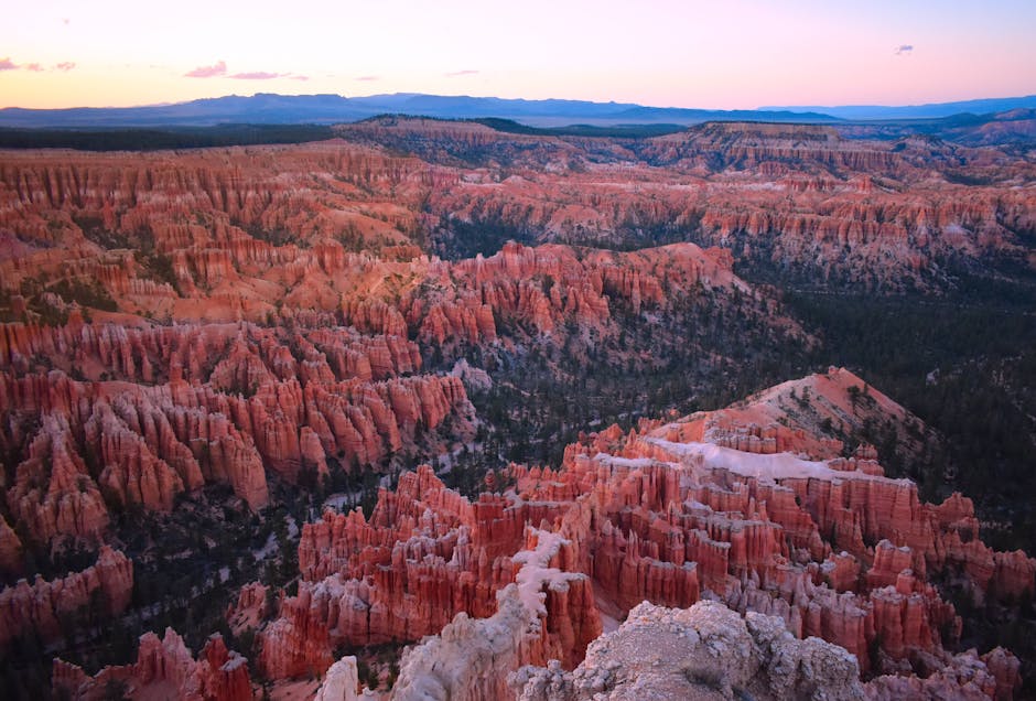 A breathtaking aerial photograph capturing the unique rock formations of Bryce Canyon National Park at twilight.
