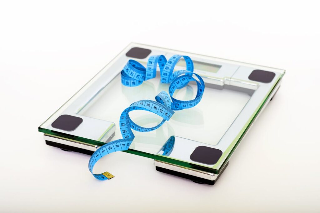 Digital scale and ruler used to measure and weigh kids’ outdoor gear for a hike