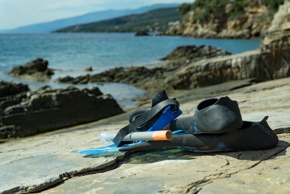 Snorkeling gear on a rocky seaside, perfect for adventures and exploring nature.