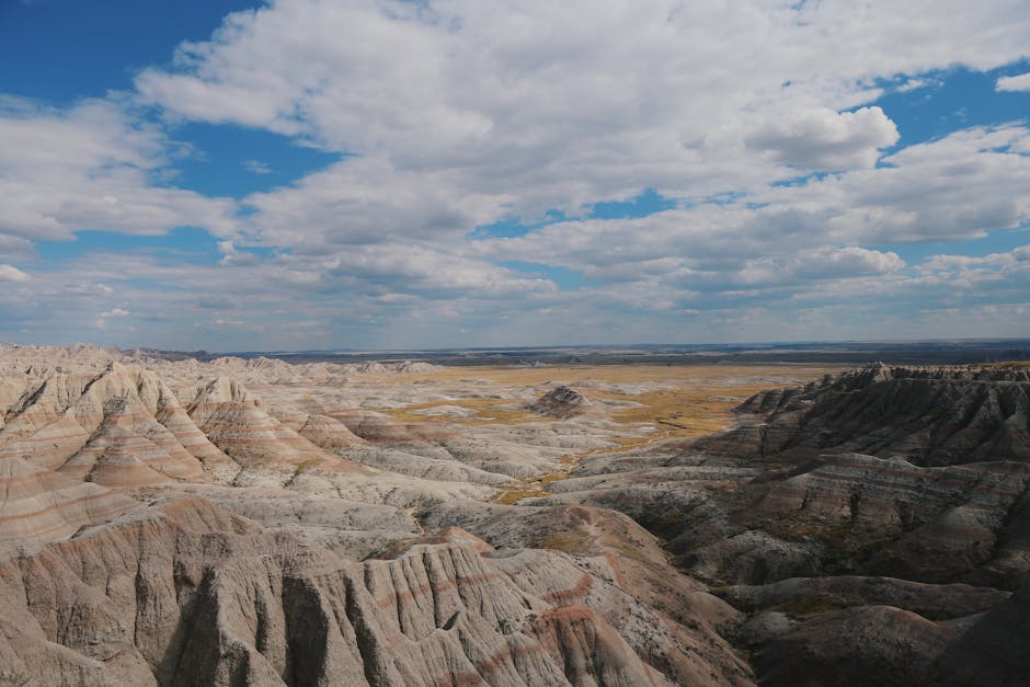 Explore the rugged geology and stunning views of Badlands National Park, South Dakota.