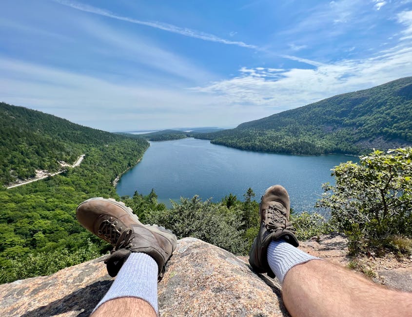 Relaxing feet overlooking Jordan Pond in Acadia National Park, Maine, USA.